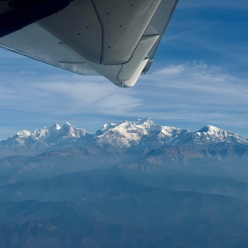 Snow-capped peaks seen from an aeroplane window
